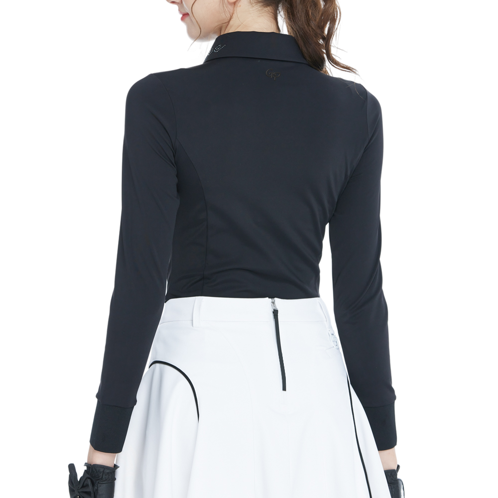 Black long-sleeved top with rhinestone embellishments and a turn-down collar.